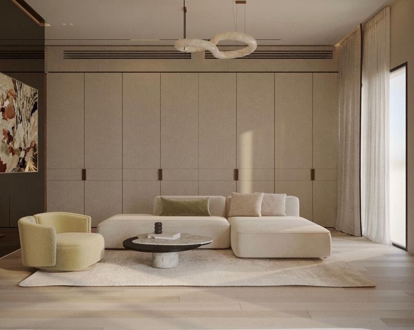 Sodic East Home — living room with modular sofa, pendant light and full-height joinery