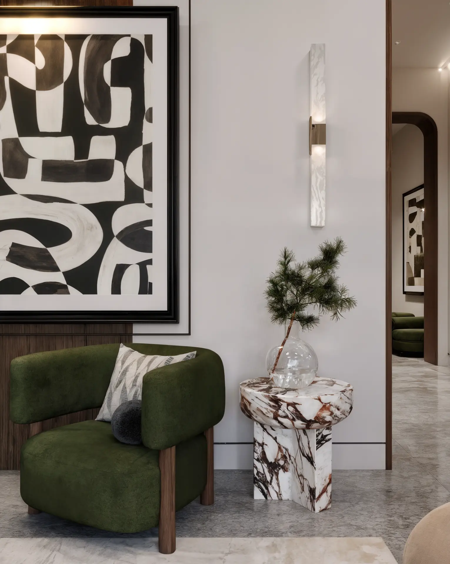 New Giza Villa — seating corner with green armchair, marble side table and abstract artwork